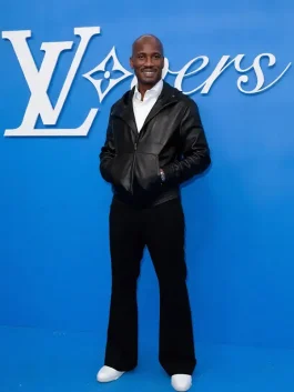 Full front view of Didier Drogba wearing a black Louis Vuitton leather jacket at Paris Fashion Week.