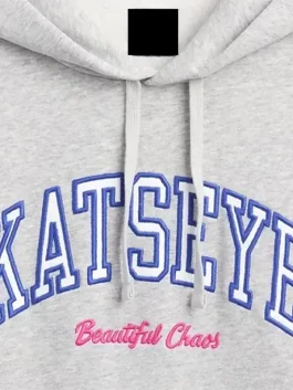 Front view of the Katseye Grey Hoodie showing the clean collar and large kangaroo pocket.