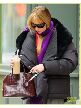 Close-up view of the front of the Jennifer Lawrence oversized black puffer coat.