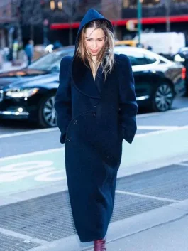 Emilia Clarke wearing an Emilia Clarke Blue Hooded Coat while walking through the streets of NYC.