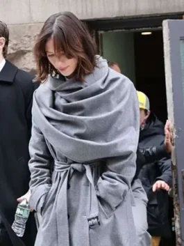 Rebecca Hall wearing The Beauty 2026 Grey Coat with a sleek and professional silhouette.