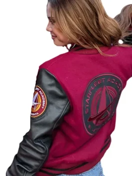 A bold maroon Starfleet Academy Varsity Jacket featuring contrast sleeves and ribbed cuffs.