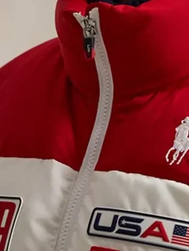 Close-up of the 2026 puffer jacket showing the heavy-duty zipper and embroidered patriotic patches.