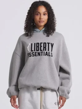 A stylish New York Liberty Fear Of God Essentials Hoodie featuring a neutral tone and sporty aesthetic.