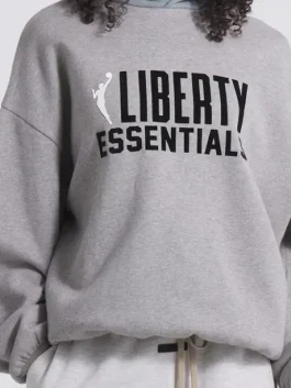 Front view of a New York Liberty Fear Of God Essentials Hoodie with a clean logo and relaxed fit.