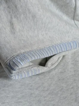 Classic pullover hoodie with anatomically articulated sleeves and a relaxed urban fit.