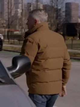 The back view of a Christopher Herrmann Brown Puffer Jacket showing even quilting and a clean fit.