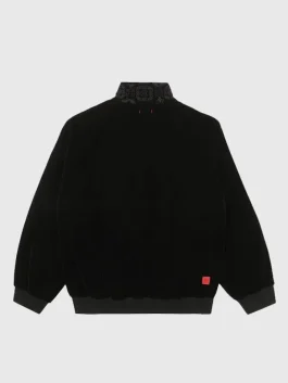 The back view of a CLOT Velvet Black Jacket showing the smooth velvet texture and clean seams.