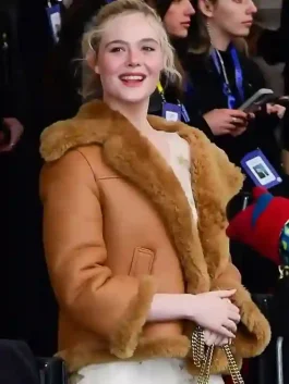 A premium Elle Fanning Brown Shearling Jacket with a rich exterior and lining.