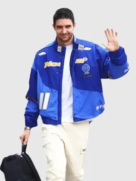 Front view of the Esteban Ocon Blue Nike Nocta Jacket featuring a secure snap button and zipper closure and stand-up collar.