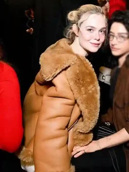 Side view of an Elle Fanning Brown Shearling Jacket showing the trim and smooth texture.