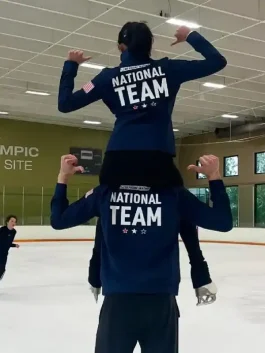 Front view of a US Figure Skating Save The Duck Jacket with a smooth pattern and a neat collar.