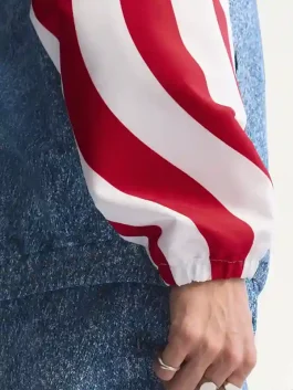 Side view of the Adidas Denim Graphic Track Top sleeves featuring iconic white and red stripes and elasticated cuffs.