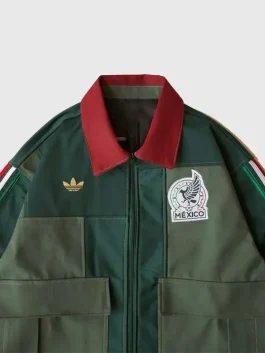A stylish Adidas Mexico Worker Jacket in deep green showing the snap button cuffs and utility side pockets.