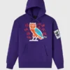The Joker Defaced Hoodie in violet with front graphic, hooded collar, and relaxed fit