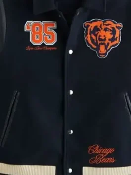 Close-up of an '85 championship-inspired varsity jacket with leather sleeves.