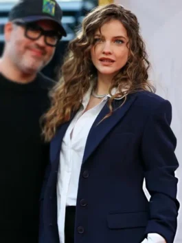 Close-up of the structured shoulders and premium wool fabric of a celebrity premiere blazer.