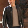 Tom Ellis CIA 2026 Colin Glass Black Leather Jacket with sharp TV series style.