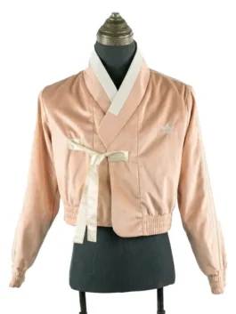Front view of a K-pop inspired Hanbok jacket with a minimalist body and decorative patterned sleeves.