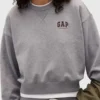 A woman wearing a premium French terry sweatshirt with a classic round neck.