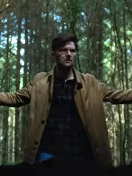 Front view of the Adam Scott brown coat from the movie Hokum 2026, styled with a plaid shirt