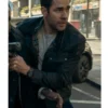 John Krasinski as Jack Ryan wearing a rugged cotton jacket with a round neck and flap pockets.