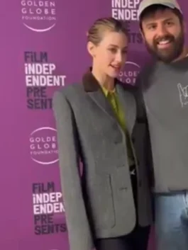 Close-up of a high-quality grey blazer with a lapel collar and front button closure.