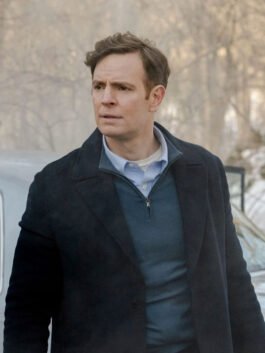 Nick Gehlfuss black wool coat with clean front shape and classic winter style.