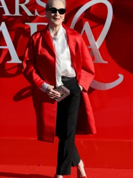 The Devil Wears Prada 2 red satin coat with refined longline silhouette.