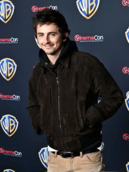 A man in a high-quality suede leather jacket with a shirt-style collar.