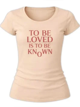 Close-up of a women's round-neck t-shirt featuring vintage-style red text.