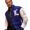 Front view of Luke Bryan American Idol blue varsity jacket with button closure and leather sleeves