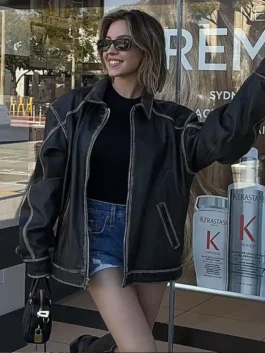 Front view of Sydney Sweeney oversized brown leather jacket with contrast seams and relaxed fit