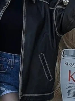 Sydney Sweeney oversized brown leather jacket showing front zipper closure and side pocket detail