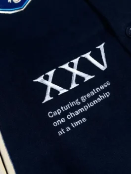 Close-up of Team Liquid varsity jacket embroidery with XXV text and front logo details