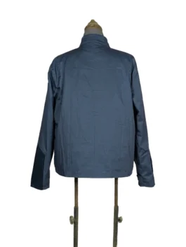 Rear view of the dark navy blue lightweight Steve Rogers civilian jacket from Captain America: The Winter Soldier on a studio dress form.