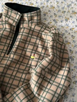 Golf-inspired reversible jacket with relaxed fit and practical outerwear style.