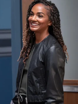 Mekia Cox leather jacket with sleek black outerwear look.