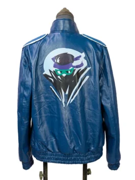 Full rear view of the blue Mortal Kombat 2 Johnny Cage leather jacket, highlighting the large printed ninja logo graphic across the center back.
