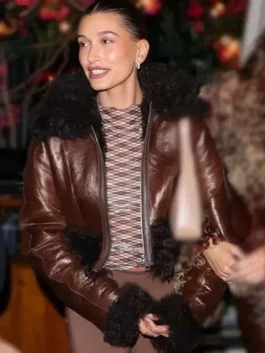 Hailey Bieber leather jacket with brown color and soft fur collar detail.