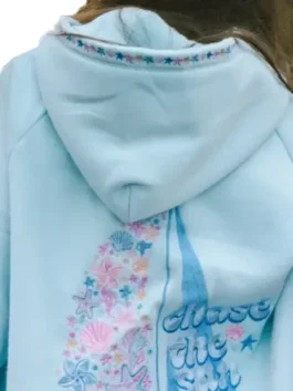 Back view of Pink Palm Puff Chase The Sun Sky Blue Hoodie with floral sailboat artwork