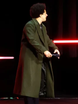 Street Fighter CinemaCon 2026 green coat with clean celebrity styling.