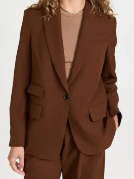 Hacks S03 brown blazer with smart TV-inspired outerwear look.