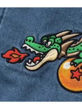 Close-up embroidery detail of Dragon Ball x BREEZE Denim Boa Jacket featuring Shenron dragon patch on blue denim