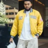 Karl-Anthony Towns Knicks Yellow Jacket with yellow satin shine, ribbed details, and relaxed game-day fit