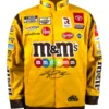 Kyle Busch Joe Gibbs Yellow NASCAR Jacket in vibrant yellow and brown cotton with bold M&M's Joe Gibbs team graphics and a sharp snap tab everyday racing build.