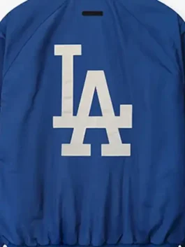 LA Dodgers Essentials Half Zip Jacket with blue polyester body, half zip front, and sporty streetwear fit