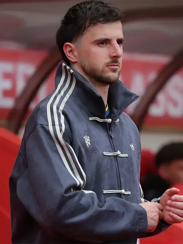 Manchester United player in grey Adidas CNY jacket with stand-up mandarin collar and Three Stripes clearly visible at Matchday 36