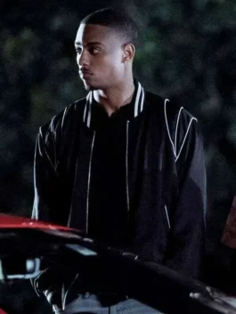 The Gates 2026 Keith Powers Black Bomber Jacket in black satin with white accents and polished movie style