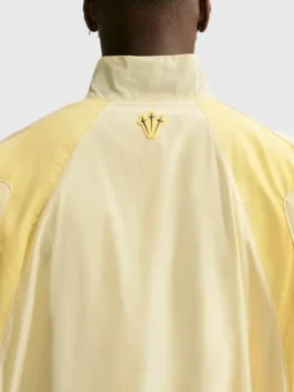 NOCTA Northstar Yellow Track Jacket back view with smooth yellow polyester and sporty rear shape
